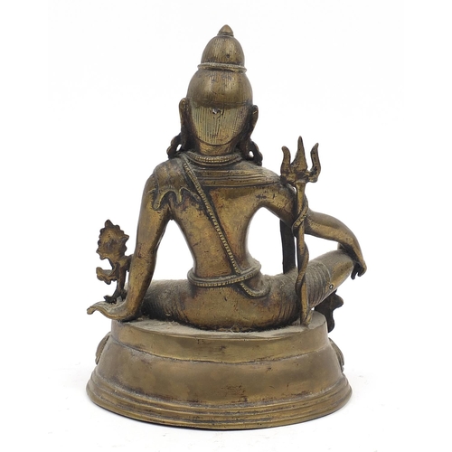 191 - Chino-Tibetan patinated bronze figure of a seated buddha, 19.5cm high