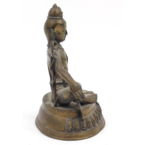 191 - Chino-Tibetan patinated bronze figure of a seated buddha, 19.5cm high