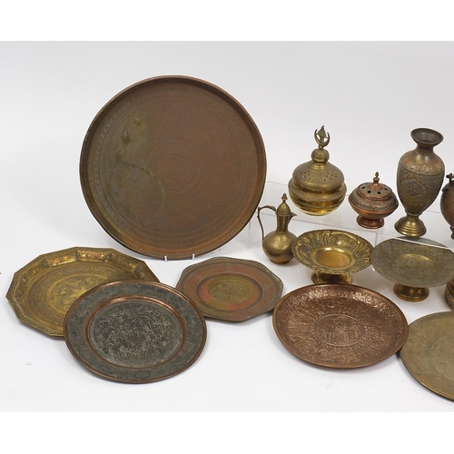 477 - Middle Eastern metalware including gong, trays and vases, mostly engraved and decorated with figures... 