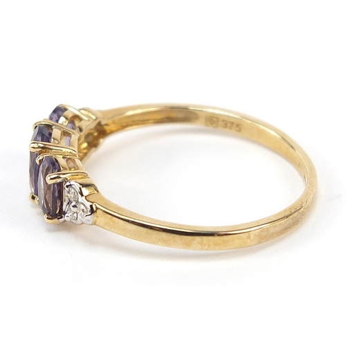 319 - 9ct gold iolite trilogy and diamond ring, size V, 2.3g