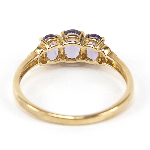 319 - 9ct gold iolite trilogy and diamond ring, size V, 2.3g