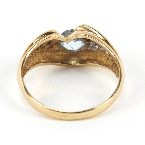 596 - 10ct gold diamond and blue stone ring, possibly aquamarine, size N, 2.6g