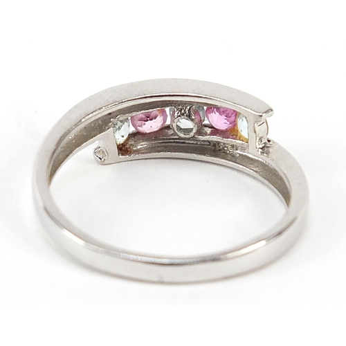 377 - 9ct white gold pink and blue stone half eternity ring, size R, 2.9g