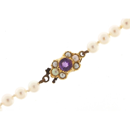 75 - Cultured pearl necklace with 9ct gold amethyst clasp, 70cm in length, 20.0g