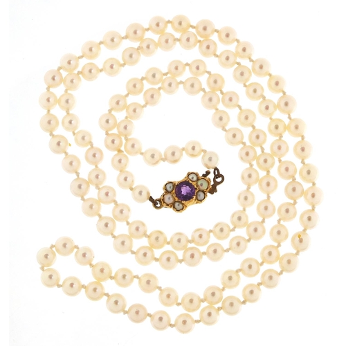 75 - Cultured pearl necklace with 9ct gold amethyst clasp, 70cm in length, 20.0g