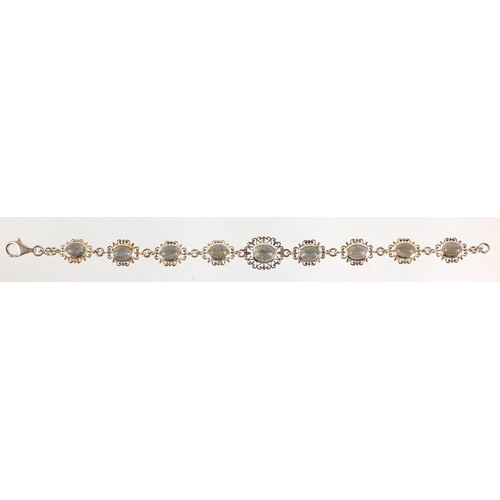 1210 - Silver bracelet set with opalescent cabochon stones, 18cm in length, 13.0g