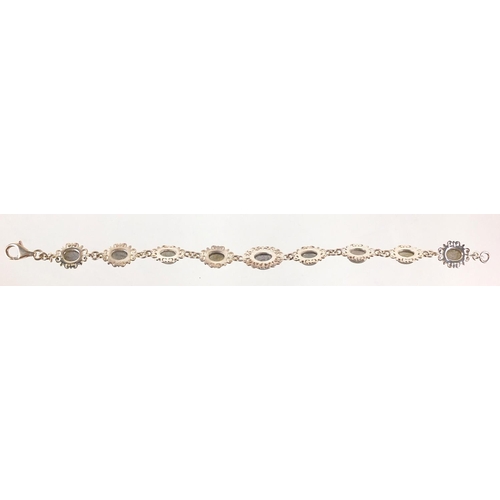 1210 - Silver bracelet set with opalescent cabochon stones, 18cm in length, 13.0g