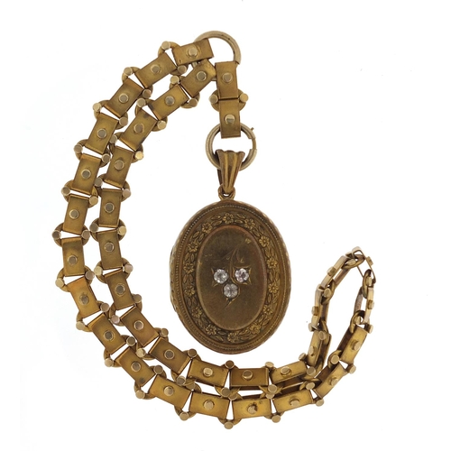 503 - Victorian aesthetic gilt metal locket on a gilt metal necklace, 6cm high and 40cm in length