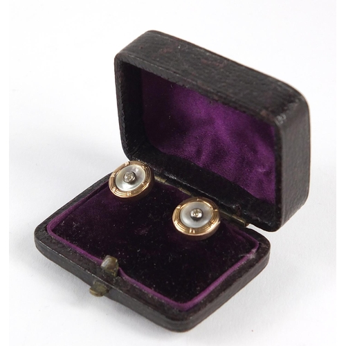 203 - Pair of Continental gold, diamond and mother of pearl gentlemen's dress studs, housed in a velvet an... 