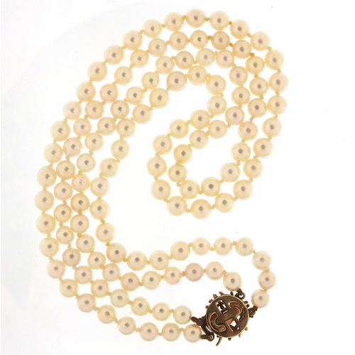 642 - Cultured pearl two row necklace with 9ct gold clasp, housed in a Mikimoto velvet and silk lined box,... 