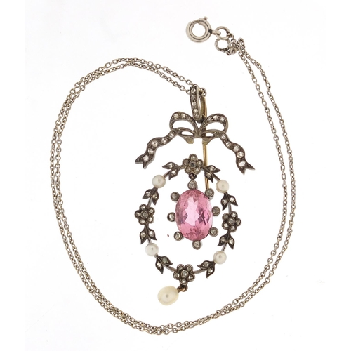 113 - Antique unmarked gold pink sapphire, diamond and seed pearl pendant on a white metal chain, housed i... 