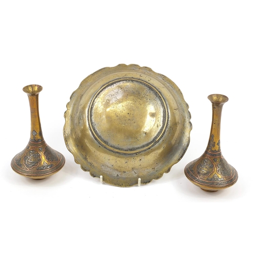 199 - Islamic brass Cairoware with silver and copper inlay comprising a pair of vases and bowl, decorated ... 