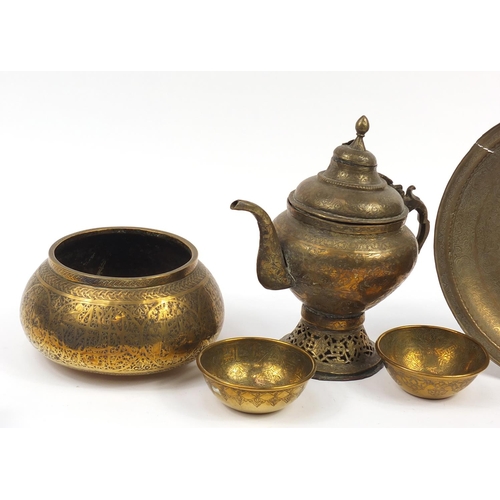 449 - Islamic Cairoware engraved with calligraphy and flowers including four bowls and a teapot, the large... 