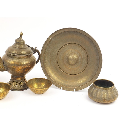 449 - Islamic Cairoware engraved with calligraphy and flowers including four bowls and a teapot, the large... 