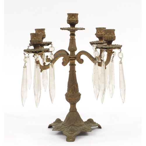 587 - Gilt metal five branch candelabra with cut glass drops, 31.5cm high