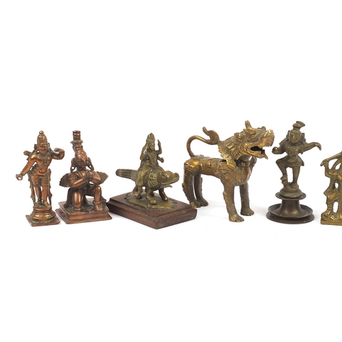 194 - Indian bronze and metalware including votive figures, the largest 13cm high