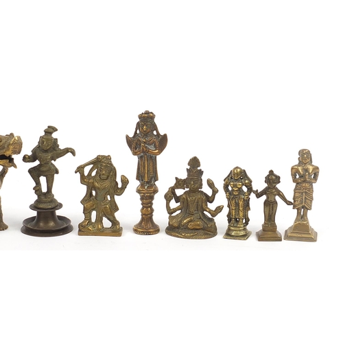 194 - Indian bronze and metalware including votive figures, the largest 13cm high