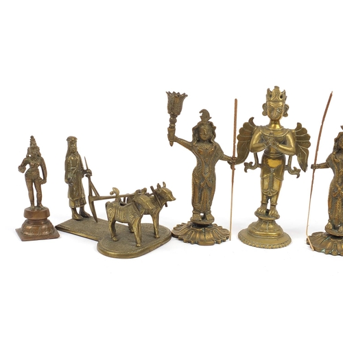 194 - Indian bronze and metalware including votive figures, the largest 13cm high