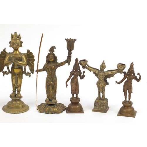 194 - Indian bronze and metalware including votive figures, the largest 13cm high