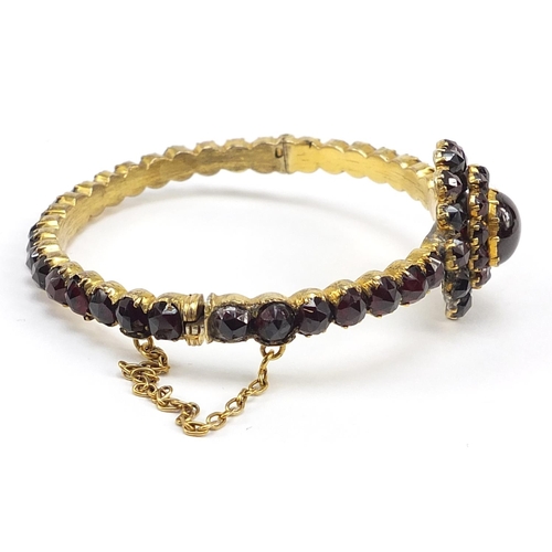 682 - Antique gilt metal garnet hinged bangle