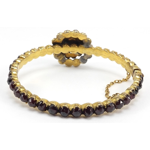 682 - Antique gilt metal garnet hinged bangle