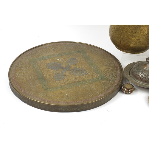 485 - Middle Eastern and Indian metalware including Persian brass table top profusely engraved with callig... 