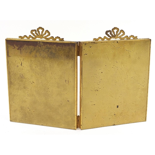 19 - Edwardian brass double photo frame with bow decoration, overall 32cm x 47cm