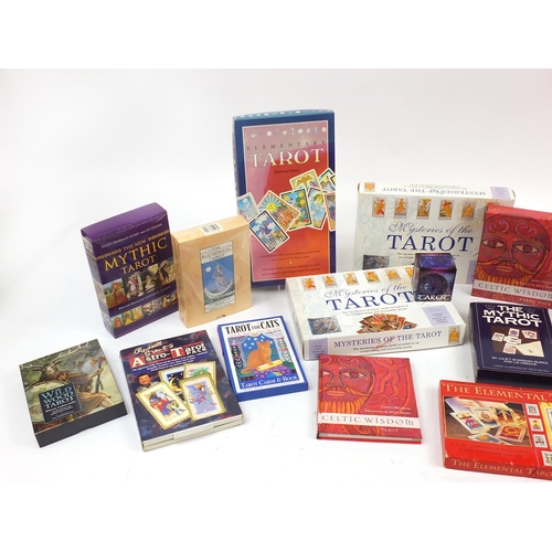 1069 - Twenty five tarot cards and book decks including The Wildwood Tarot and Russell Grant's Astro Tarot ... 