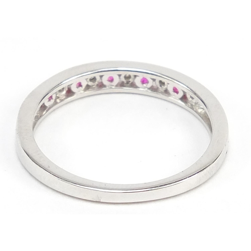 680 - 9ct white gold ruby and diamond half eternity ring, size L/M, 1.7g