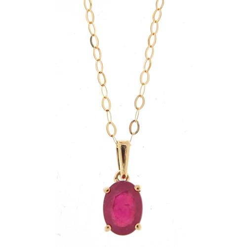 539 - 9ct gold ruby pendant on a 9ct gold necklace, 1.2cm high and 46cm in length, total 1.0g