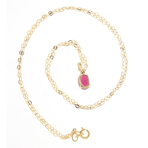 539 - 9ct gold ruby pendant on a 9ct gold necklace, 1.2cm high and 46cm in length, total 1.0g