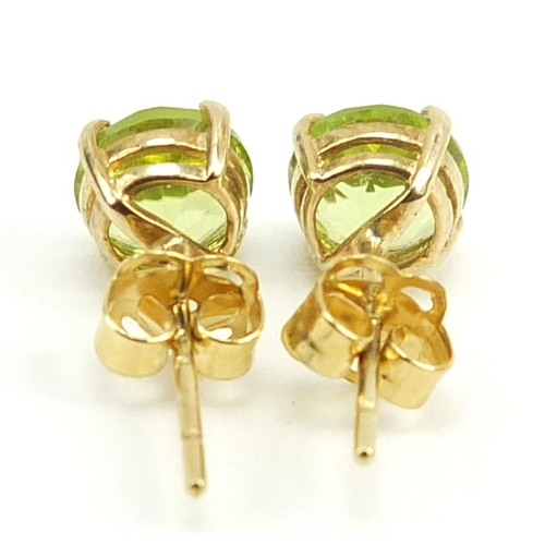 788 - Pair of 9ct gold peridot solitaire stud earrings, 5mm in diameter, 0.6g