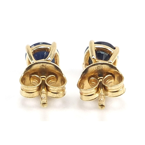 464 - Pair of 9ct gold sapphire solitaire stud earrings, 4.8mm in diameter, 0.9g