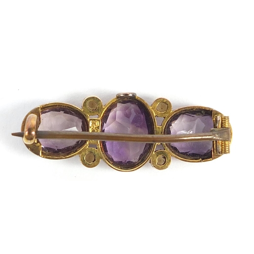 456 - 19th century 9ct gold amethyst and seed pearl brooch, 3cm wide, 3.7g