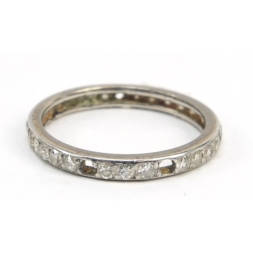 1043 - Unmarked white metal diamond eternity ring, size M/N,, 2.1g