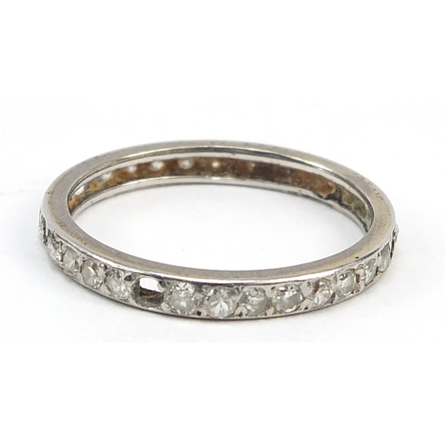 1043 - Unmarked white metal diamond eternity ring, size M/N,, 2.1g