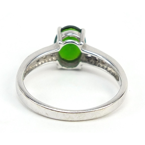 1136 - 9ct white gold green stone ring, set with white sapphires to the shoulders, size N, 2.6g