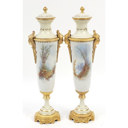 907 - Large pair of French porcelain vases and covers with gilt bronze mounts in the style of Sevres, each... 