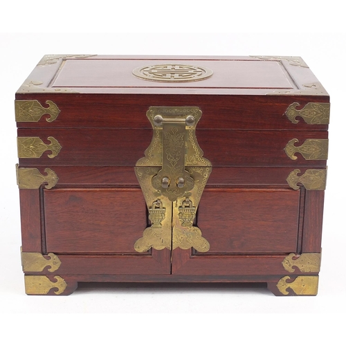 1171 - Chinese hardwood jewellery chest with engraved brass mounts and lift up lid above a cupboard base en... 