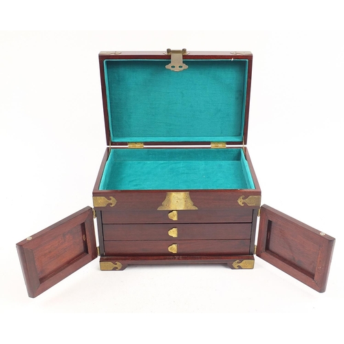 1171 - Chinese hardwood jewellery chest with engraved brass mounts and lift up lid above a cupboard base en... 