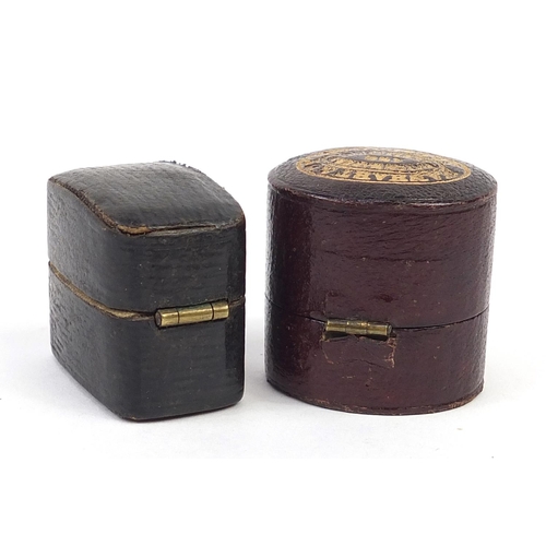 888 - Two Georgian leather, velvet and silk lined ring boxes including Hanhart & Co, the largest 3cm high