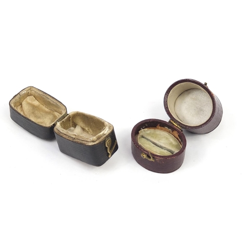 888 - Two Georgian leather, velvet and silk lined ring boxes including Hanhart & Co, the largest 3cm high