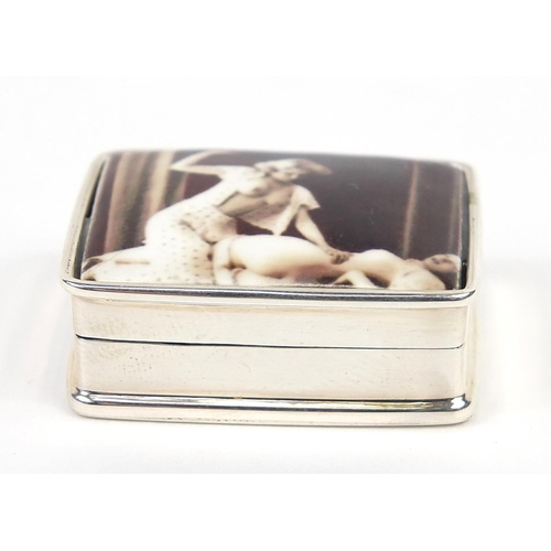 845 - Rectangular silver patch box, the hinged lid enamelled with two erotic females, 3.2cm wide, 20.8g