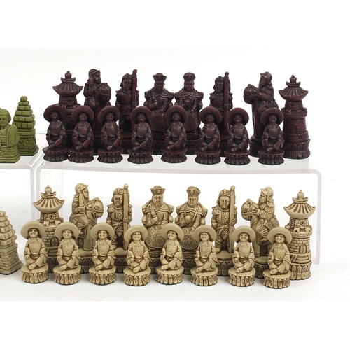 1240 - Two chess sets including a Chinese red lacquer and ivorine design example, the largest pieces each 9... 