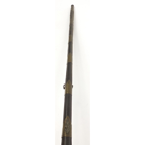 396 - Indian Jezail flintlock musket with engraved brass mounts, dated 1853, 140cm in length