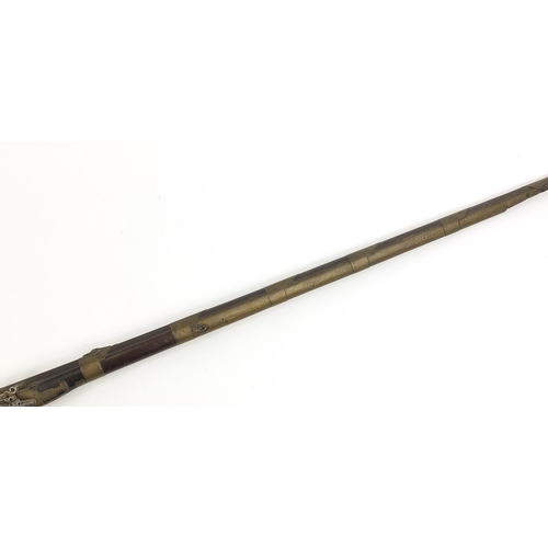 396 - Indian Jezail flintlock musket with engraved brass mounts, dated 1853, 140cm in length