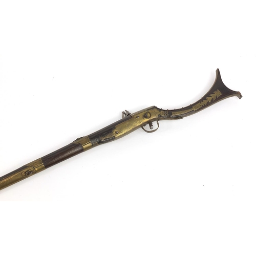 396 - Indian Jezail flintlock musket with engraved brass mounts, dated 1853, 140cm in length