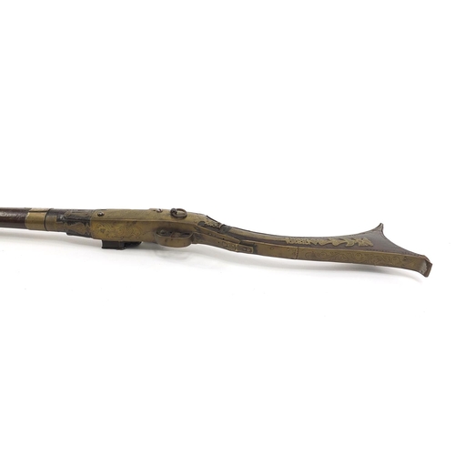 396 - Indian Jezail flintlock musket with engraved brass mounts, dated 1853, 140cm in length