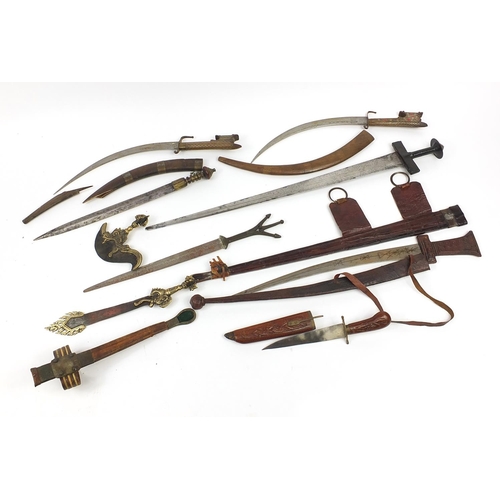 408 - Indian and Tibetan weapons including two swords with leather scabbards and Kartika, the largest 88cm... 