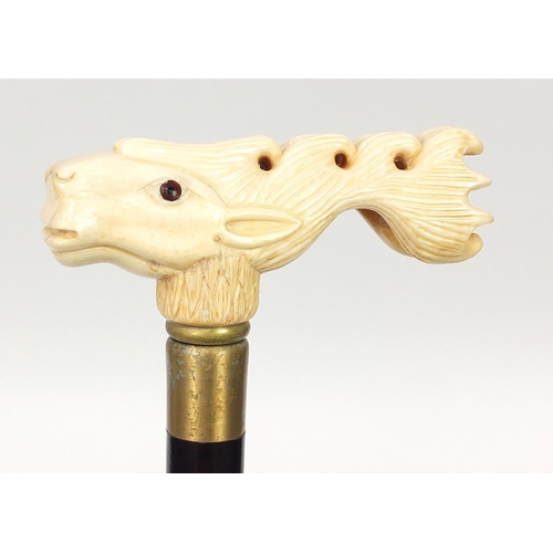 1131 - Hardwood walking stick with carved bone stag design handle, 91.5cm in length